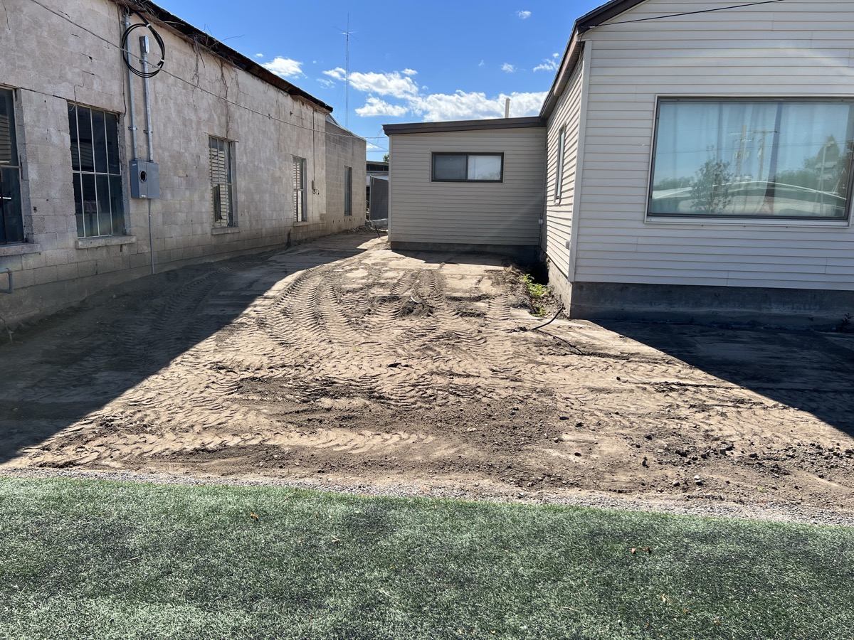 Compacted base prepared for artificial turf