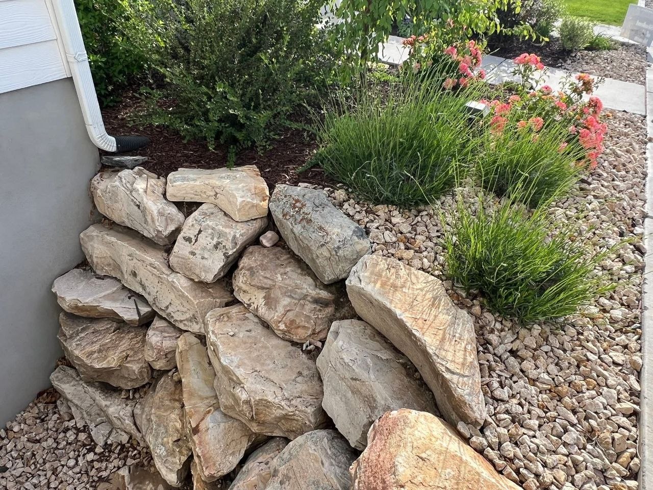 SERBY crew placing boulders on a residential project