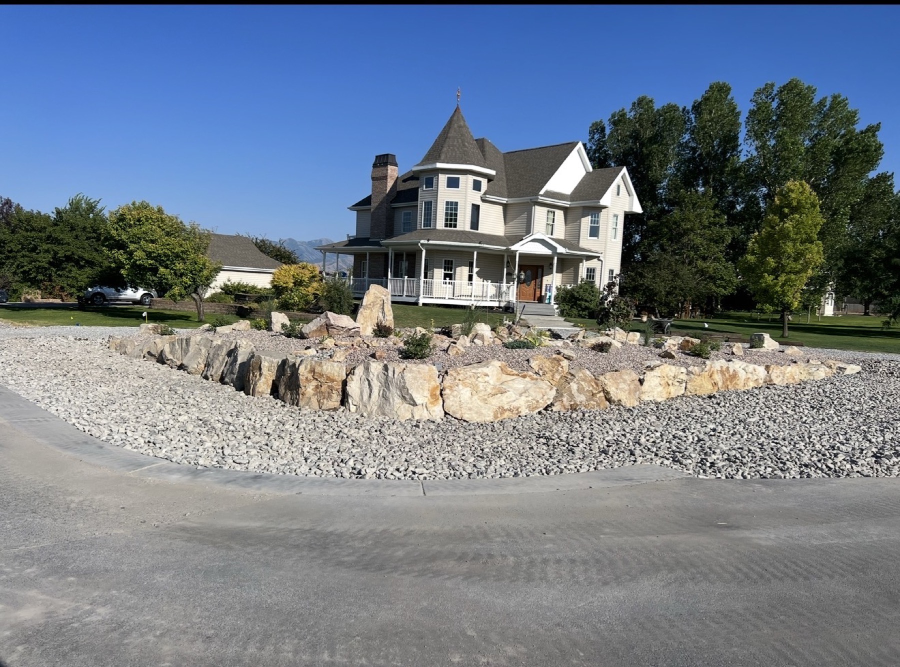 Completed boulder and gravel landscape at historic home