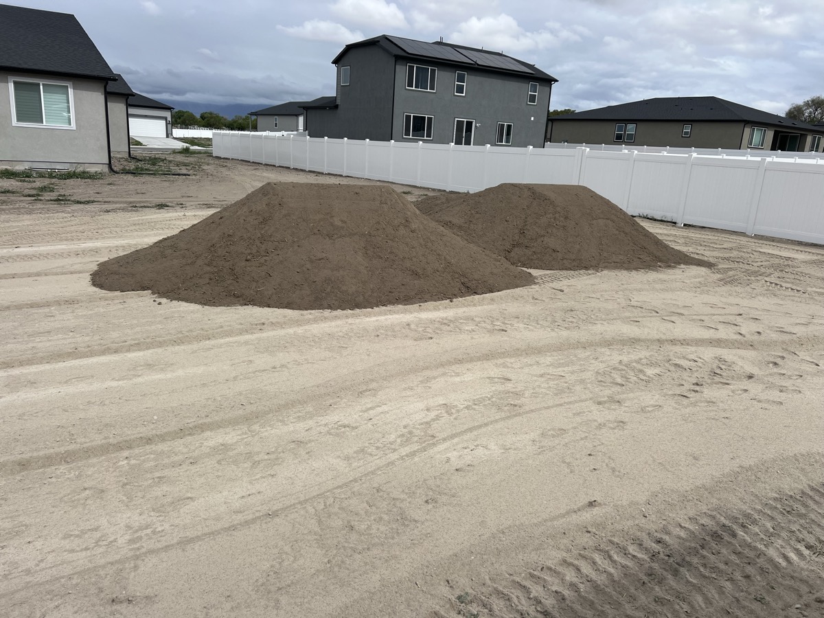 Topsoil delivery and grading at residential lot