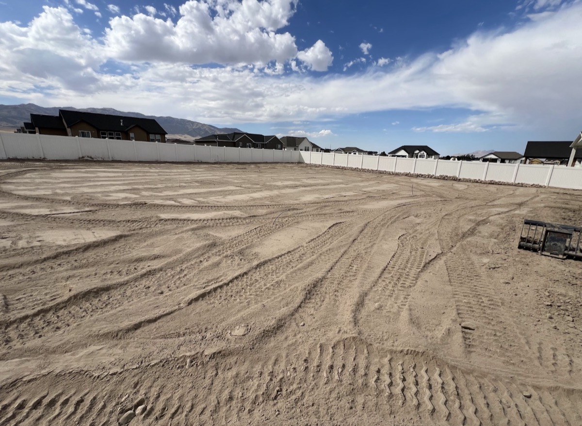 Residential lot graded and prepped with topsoil