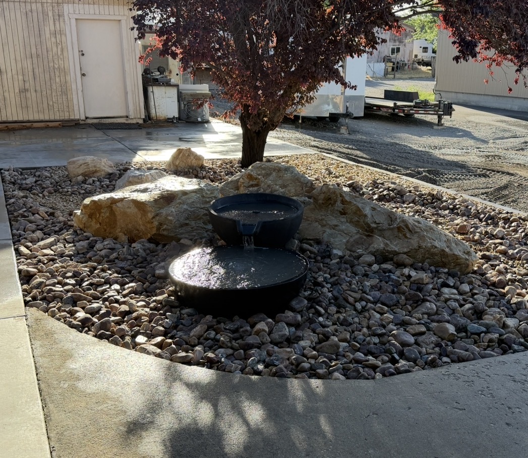 Completed water feature with natural stone surround