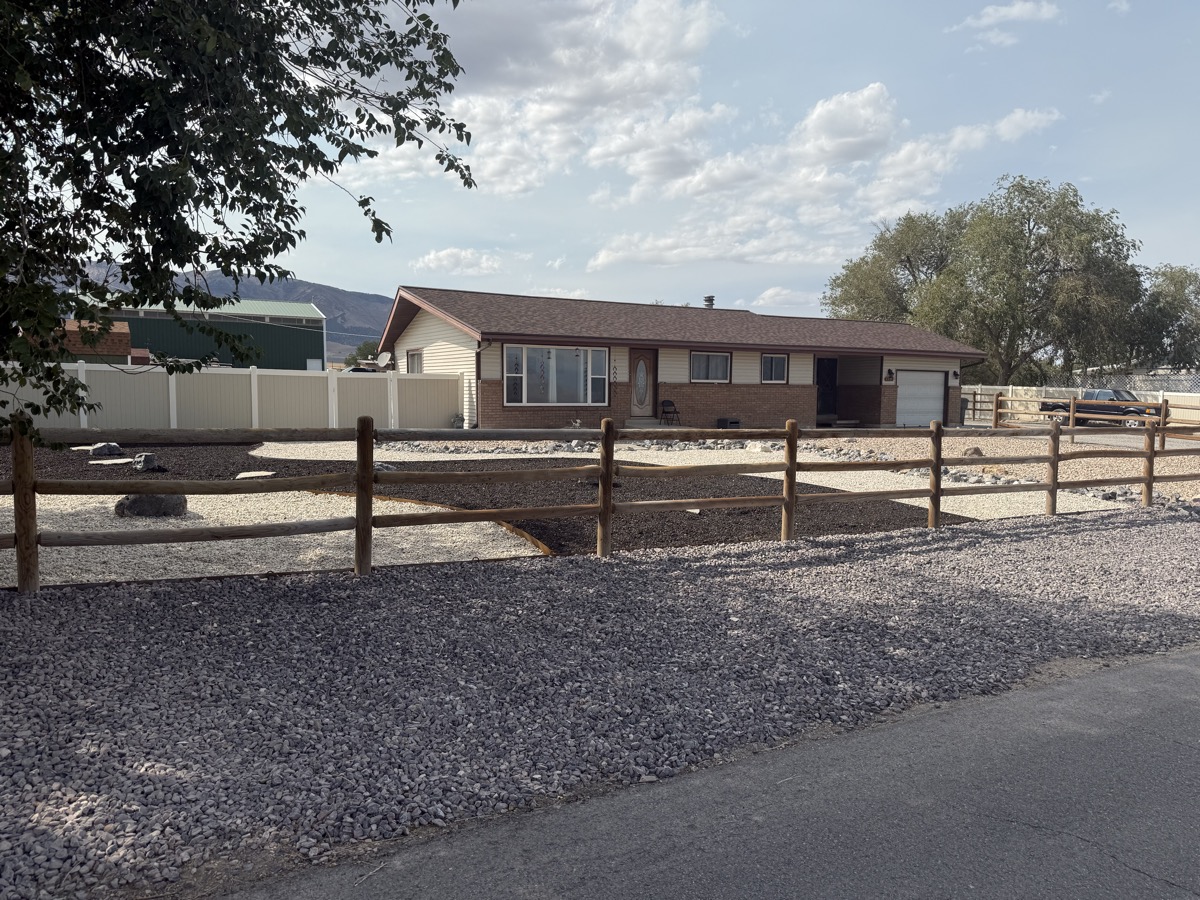Xeriscape with rustic wood fence and gravel