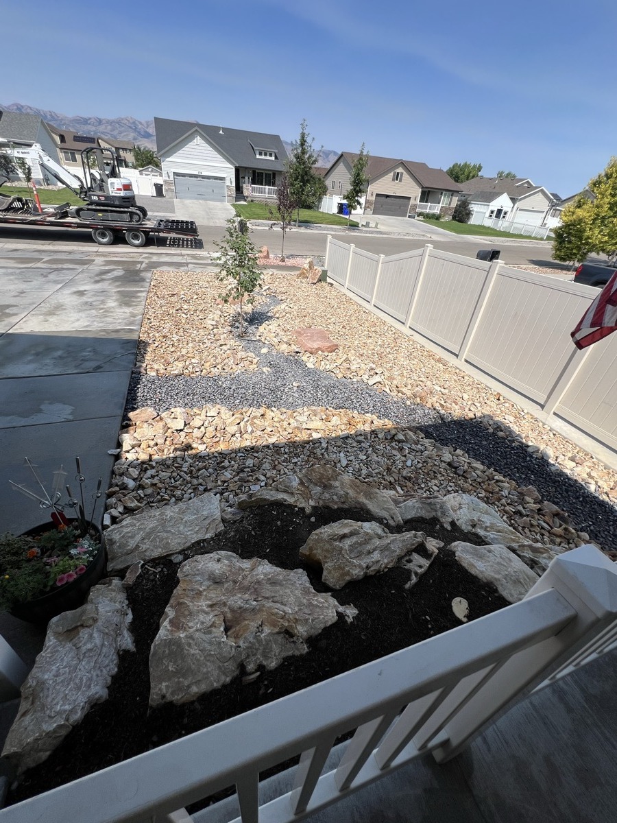 Side yard xeriscape with gravel and plants